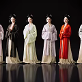 Women in Traditional Attire Standing in Line on Reflective Floor with Black Background