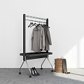 Black Rolling Clothes Rack with Gray Coats Lower Shelf High Heels and Woven Basket