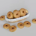 Freshly Baked Golden Brown Donuts in Wicker Basket with Scattered Ones Around