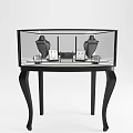 Black Glass Display Cabinet With Jewelry Items And Curved Legs