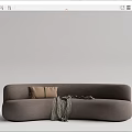 Modern Curved Multi Seater Sofa In Neutral Tones With Brown Pillows And Plaid Blanket