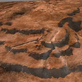 Rugged Rocky Terrain With Natural Geological Formations And Eroded Surfaces