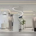 Modern Clothing Store Interior With Arched Windows Hanging Clothes And Plant Decor