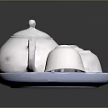 White Ceramic Teapot With Three Cups On Blue Rimmed Tray For Daily Use