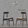 Mid century dining chairs featuring dark and light wooden legs and white padded seats