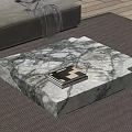 Modern Living Room With Natural Marble Coffee Table And Stacked Books