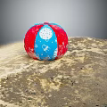 Red White Blue Sports Equipment Ball With Star And Moon Patterns On Sandy Ground