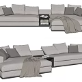 Light Gray Sectional Sofa With Multiple Pillows Side Table Books And Throw Blanket 3d model