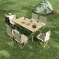 Outdoor Camping Table with Foldable Design and Six Chairs for Picnic in Grass Area