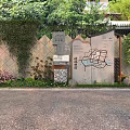 Garden Ornament Design With Map Signage Green Plants Stone Wall And Lighting