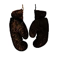 Two Old Worn Boxing Gloves Hanging As Vintage Sports Equipment
