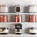 Different Colored Kitchen Appliances Displayed On White Shelves With Various Styles