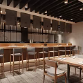 Japanese Restaurant Interior With Wooden Counter Dining Tables Chairs And Warm Lighting