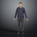 Man In Dark Blue Sweater Dark Pants And Black Shoes Standing On Gray Background