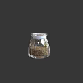 Clear Transparent Glass Jar Filled With Brown Granules On Dark Background