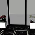 Indoor Plant Arrangement With White Planters Red Flowers And Green Shrubs By Glass Door