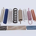 Assorted Metal Springs In Various Colors And Different Coil Shapes