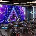Dynamic Fitness Studio With Spin Bikes Large Screen Colorful Lighting And Arrow Signs