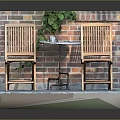 Outdoor Wooden Table with Two Chairs and Green Vines Against Brick Wall Slate Floor
