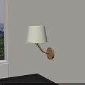 Modern Wall Lamp With White Fabric Shade And Metal Base Mounted On White Wall