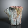 Natural Wooden Stump Planter With Green Plant Growth And Rustic Texture