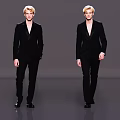 Two Male Models Wearing Black Suits Walking on Runway Against Gray Background