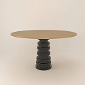 Round Dining Table With Gold Tabletop And Black Spiral Stacked Leg Design