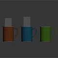 Three Colorful Mugs Orange Blue Green With Handles On Dark Surface