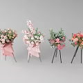 Assorted Flower Bouquets With Pink Wrapping On Metal Stands Against Grey Background