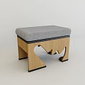 Modern Wooden Stool With Gray Padded Seat And Unique Carved Legs