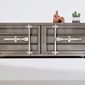 Industrial Style Metal Cabinet With Double Doors Metal Latches And Decorative Statue Cactus On Top