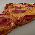 Delicious Freshly Baked Pepperoni Pizza Slice With Cheesy Topping And Crispy Golden Crust