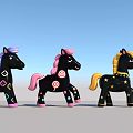 Three Black Toy Ponies with Various Decorations Purple Pink Yellow Manes and Colorful Patterns