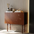 Modern Entryway Console Cabinet With Brown Wood Vertical Slats Metal Legs And Decor Items On Top