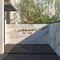 Modern Front Desk Reception Area With Glass Doors And Marble Wall Features