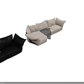 Cream Fabric And Black Leather Sectional Sofa With Striped Blanket Pillows And Decorative Balls