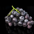 Fresh Plump Juicy Black Grapes Bunch On Reflective Black Background