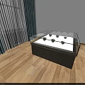 Display Showcase Shelf with Glass Top Dark Base and Display Items on Wooden Floor