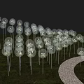 Garden Ornaments Transparent Spherical Decorations Arranged in Arched Shape on Grassland With White Path Alongside