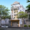 Three Story Detached Villa Featuring White Exterior Ornate Balconies Garage And Lush Trees