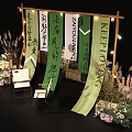 Photo Check In Spot With Wooden Frame Green Calligraphy Banners White Chairs And Flower Decorations