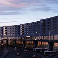 Modern Airport Terminal Architecture With Runways And Parked Airplanes At Night