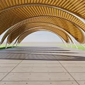 Wooden Pergola With Arched Roof Design And Concrete Pavement On Grass Lawn