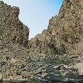 Magnificent Natural Rocky Canyon Scenery With Clear Running Stream Under Bright Cloudless Blue Sky