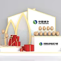 Commercial Exhibition Display Equipment with Brand Logo Golden Spheres Red Gift Boxes and Flower Bouquets