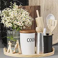 Modern Kitchenware Display With Jars Flowers Eggs Utensils And Oil Bottles