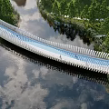 Scenic Wavy White Landscape Bridge Over Water With Reflection And Green Trees