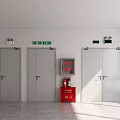 Room Interior With Four Gray Doors Green Exit Signs And Red Fire Cabinet
