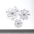 Modern Minimalist Metal Wall Decor With Three Radiant Spiral Pieces on White Wall