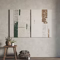 Abstract Textured Canvas Artworks On Neutral Wall With Wooden Stool And Potted Plant